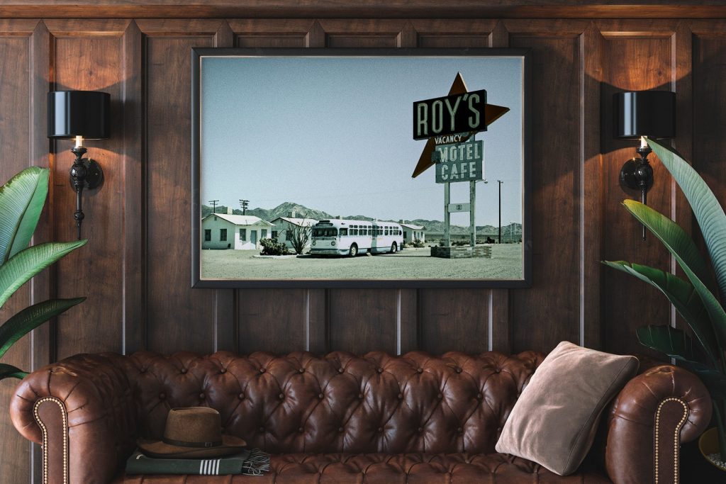 Fine art photography displayed Roys Cafe image above leather couch