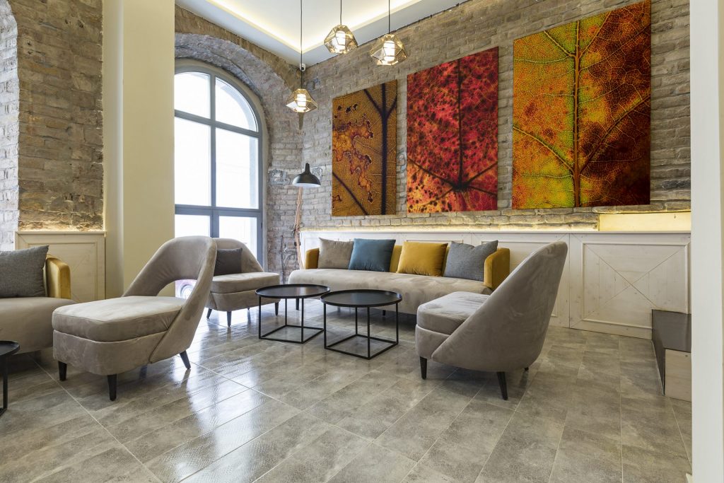 Fine art photography displayed, Fall Leaves photography in lounge setting