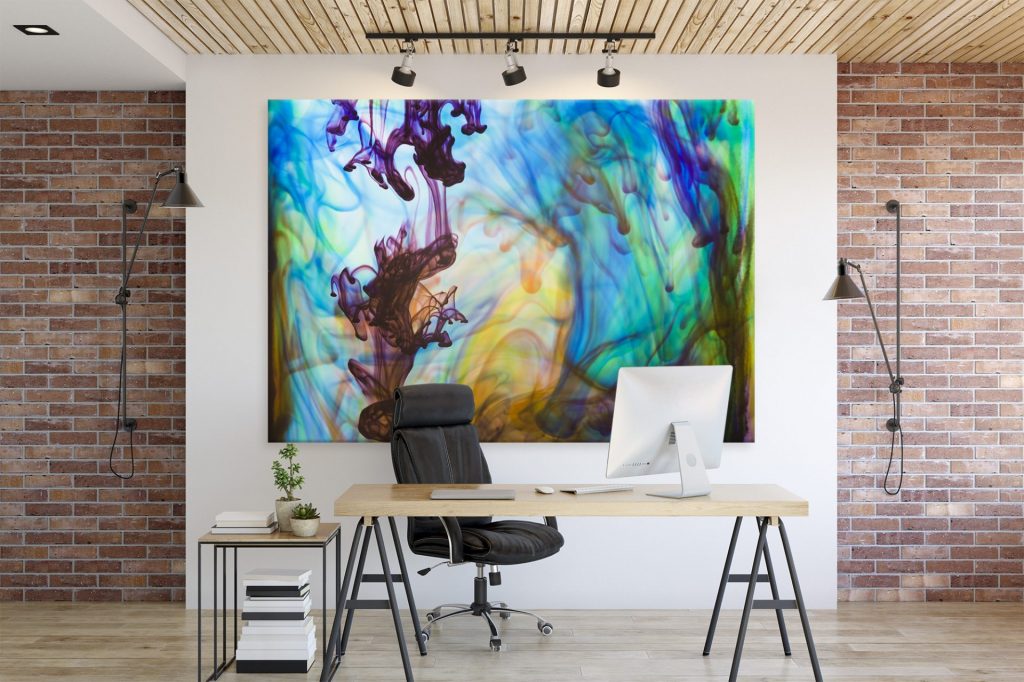 Fine art photography displayed, large colourful image behind office desk